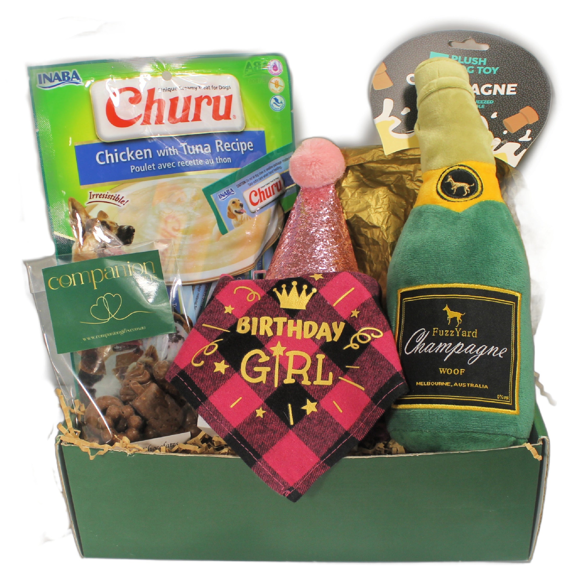 Gift basket for a female dog with a birthday bandana and party hat Fuzzyard champagne squeaky toy chicken treats and doggy chocolate.