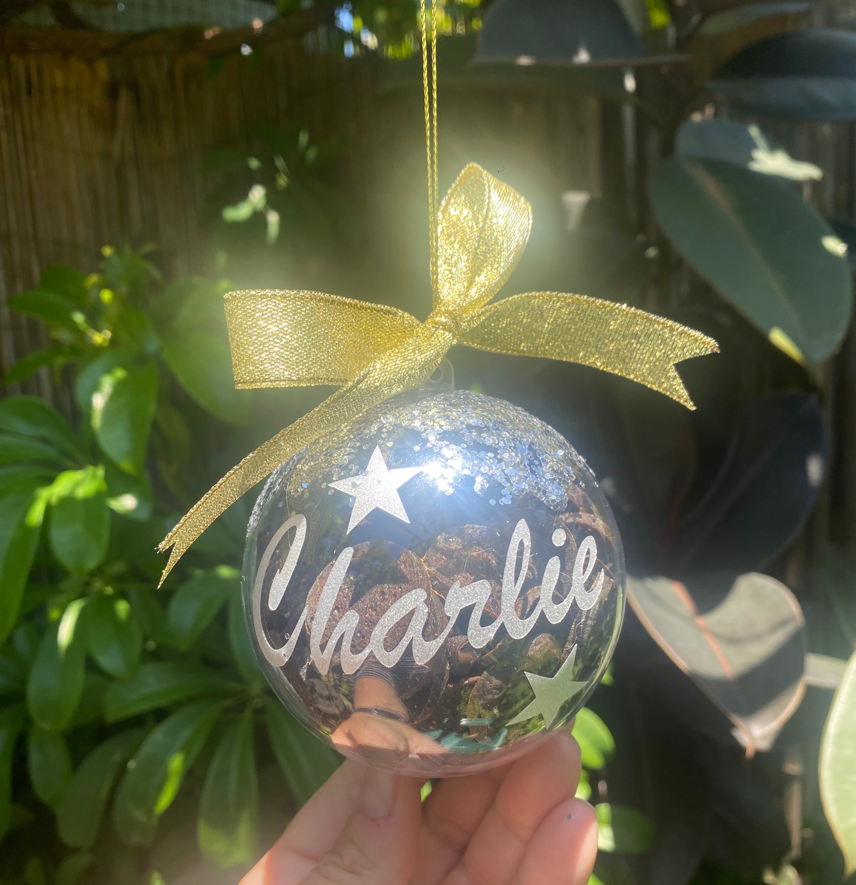 Handmade Christmas treat bauble with festive design and treats inside.