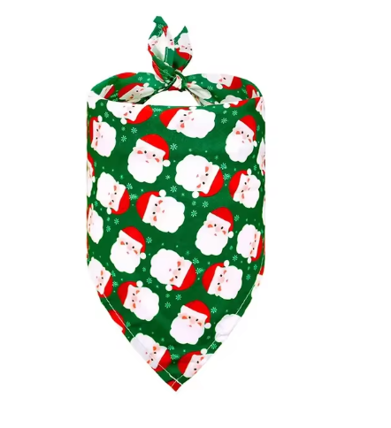 The green Santa-themed bandana placed under a Christmas tree, ready for gifting.