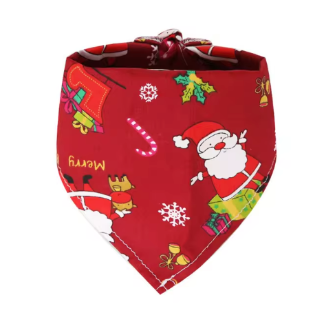 Flatlay of the red Santa-themed bandana with festive decorations.