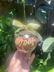 Close-up view of the Christmas treat bauble showing the treats inside.