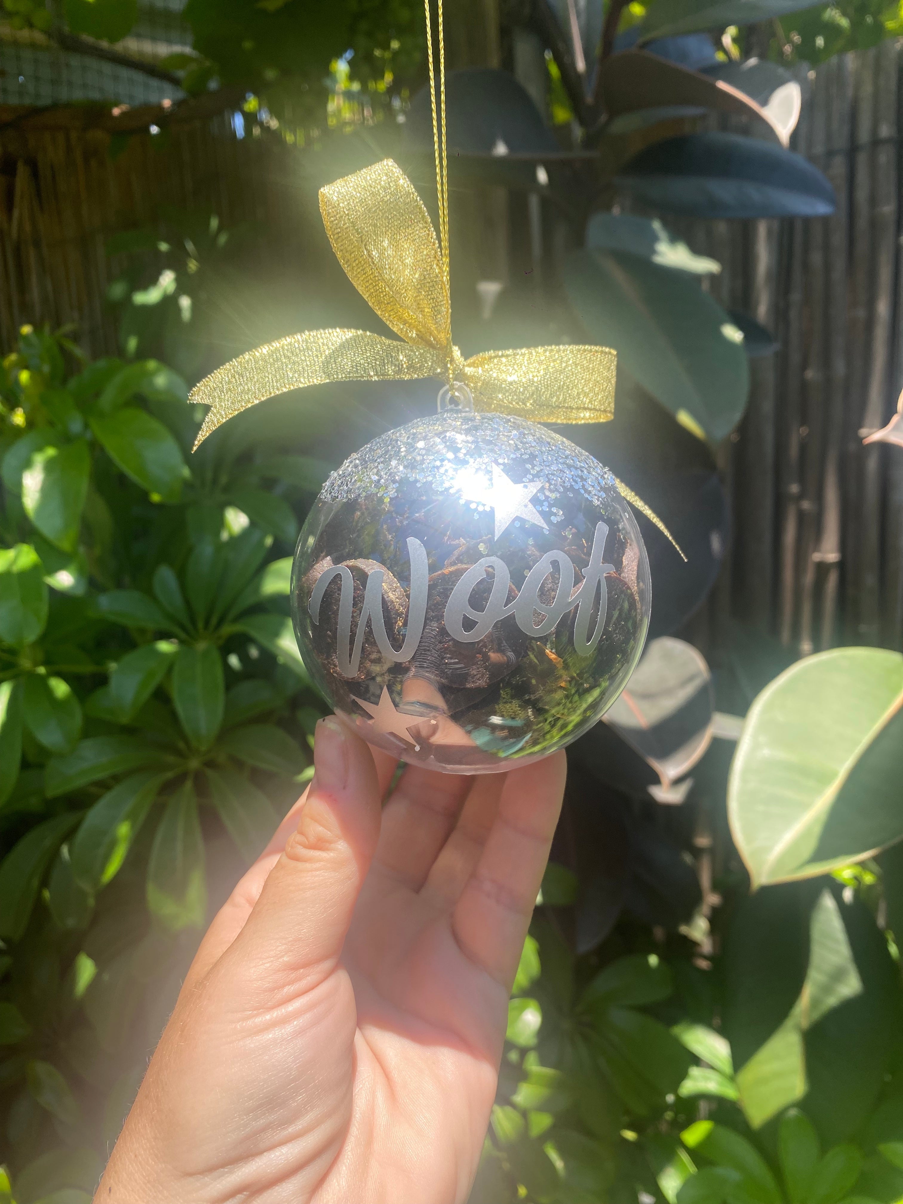 Personalized Christmas treat bauble with silver writing.